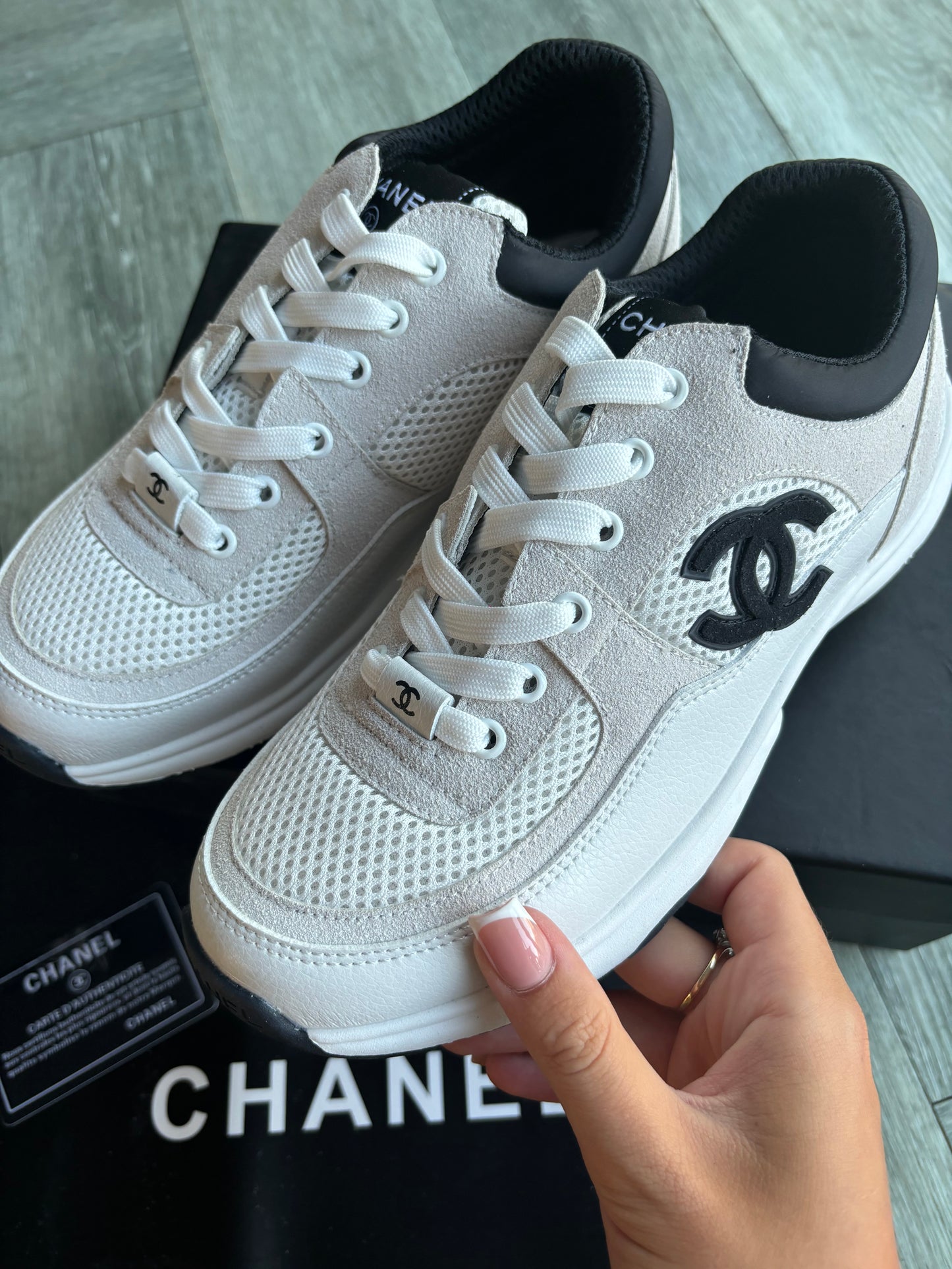 Beige and black cc trainers
