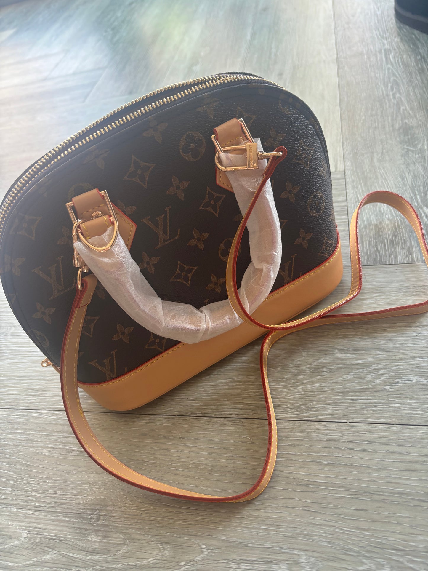 Brown flower handbag comes with long strap