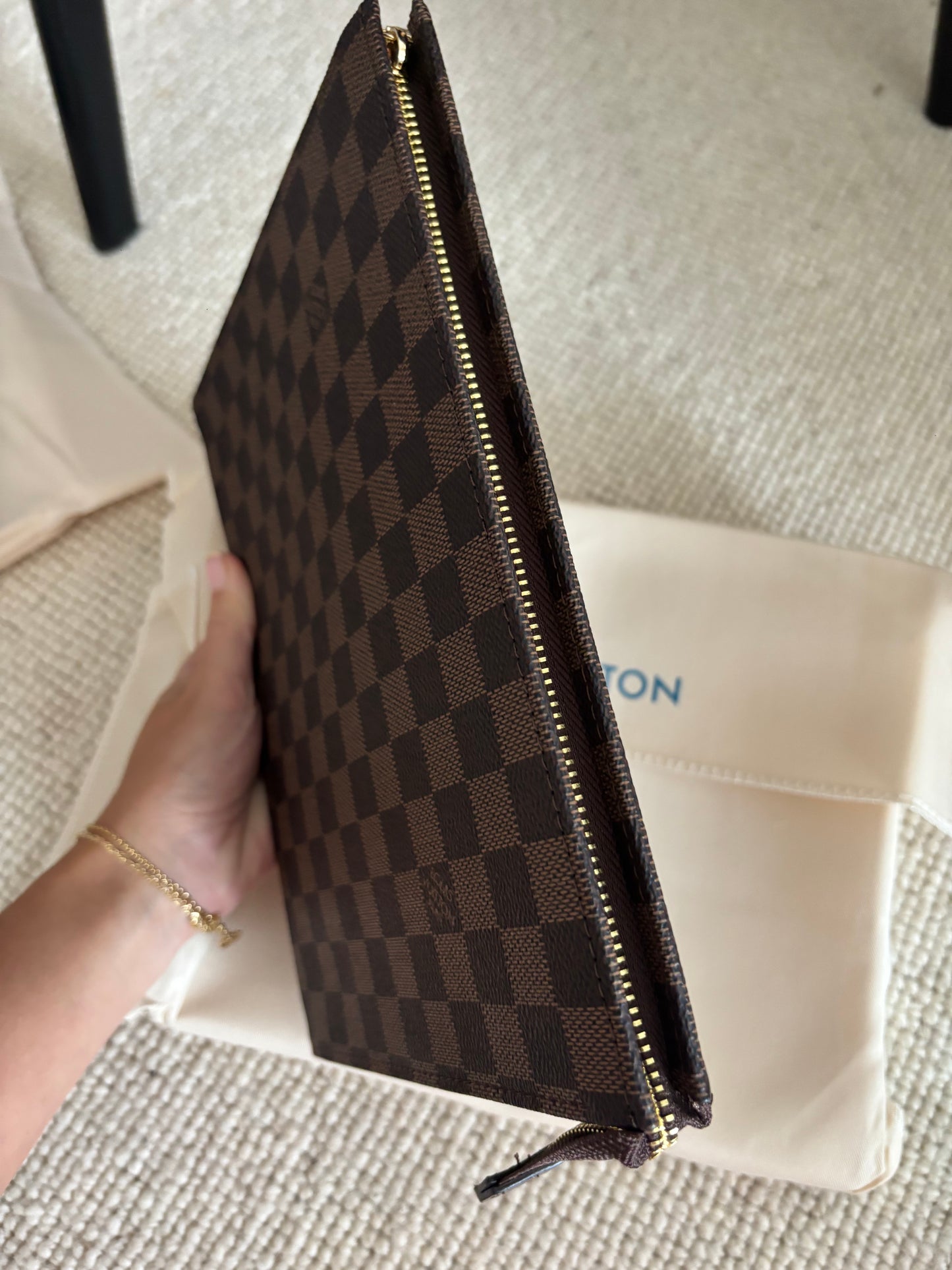 Brown grid clutch bag