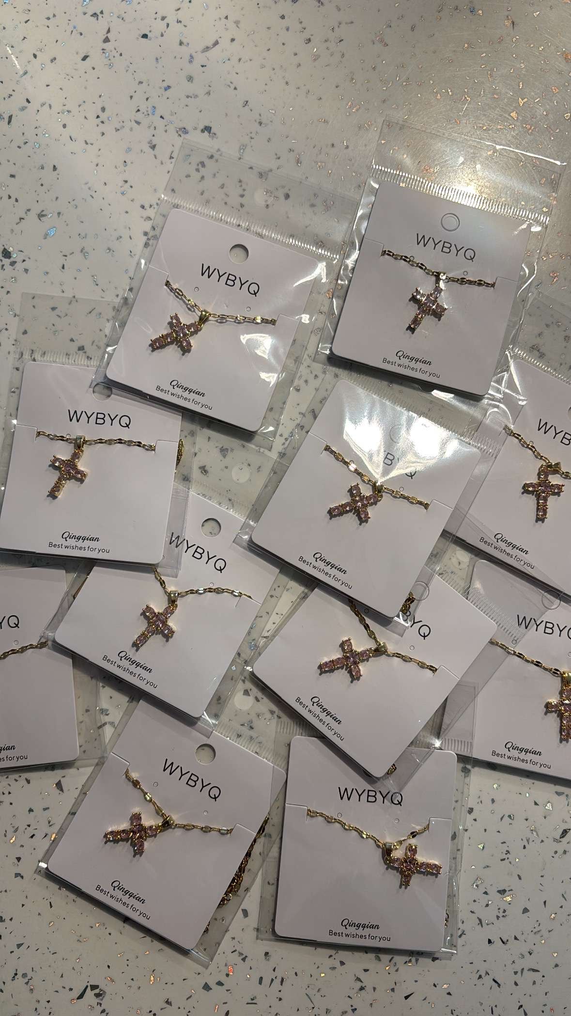 Gold & pink cross necklace styled by lr