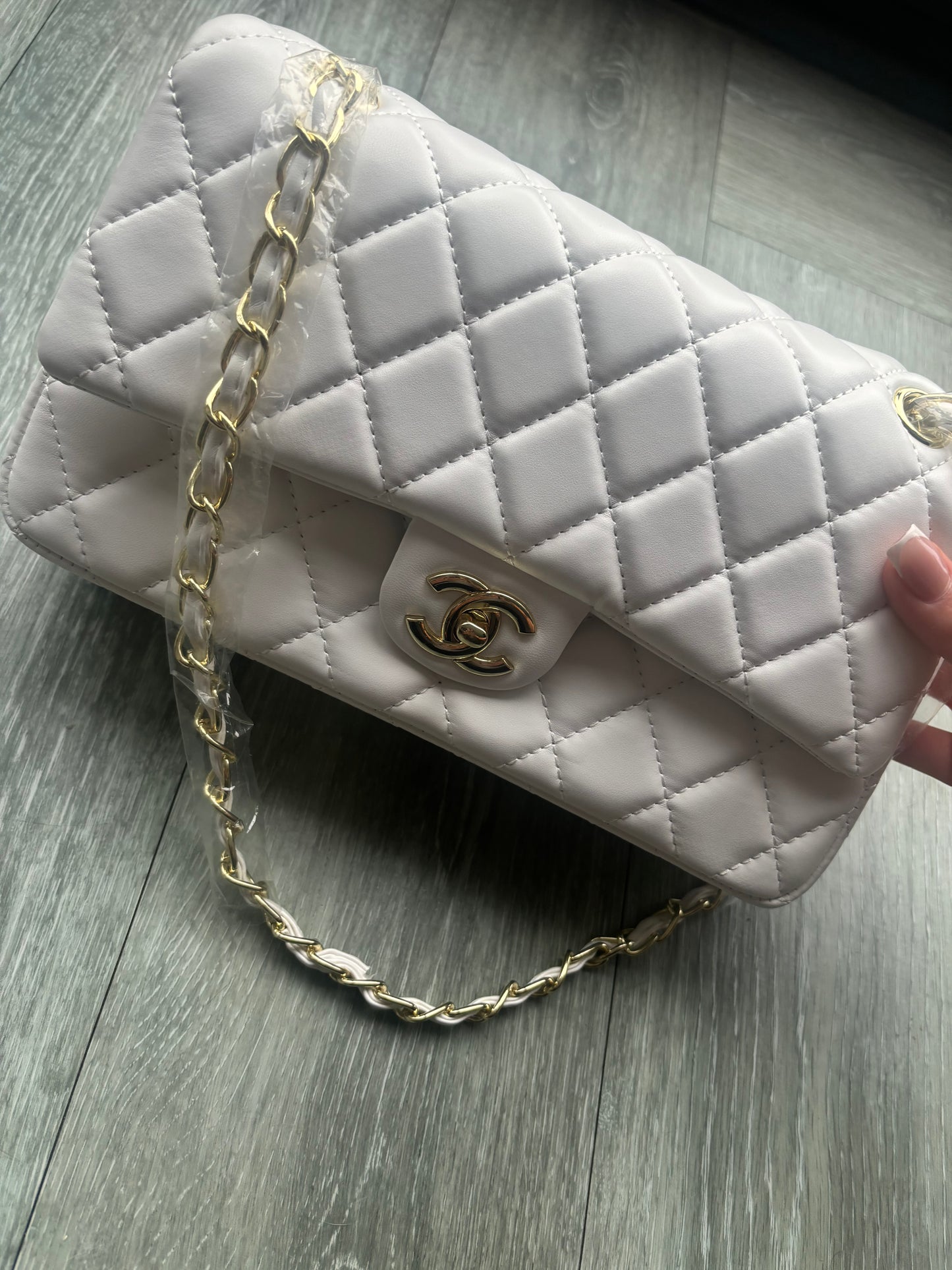 White and gold CC crossover bag
