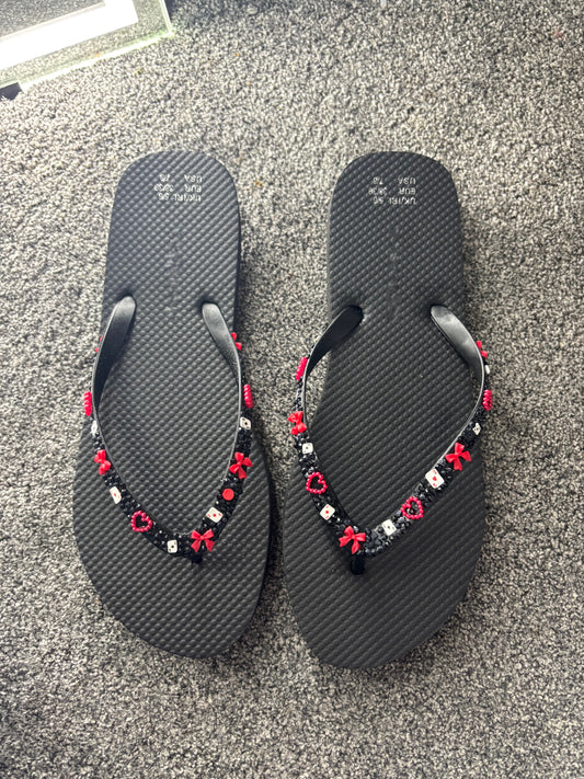 Black flip flops with red and black gems size 5/6