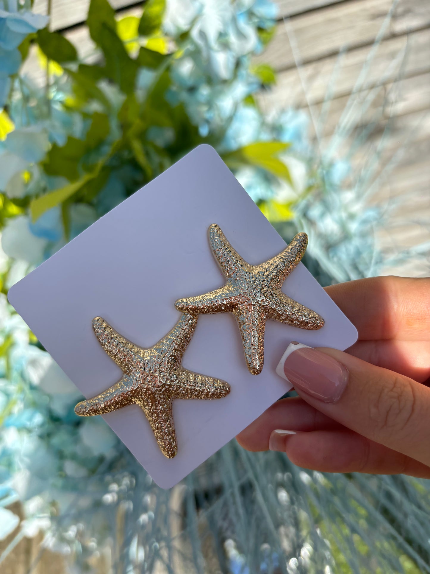 Smaller gold star fish earrings