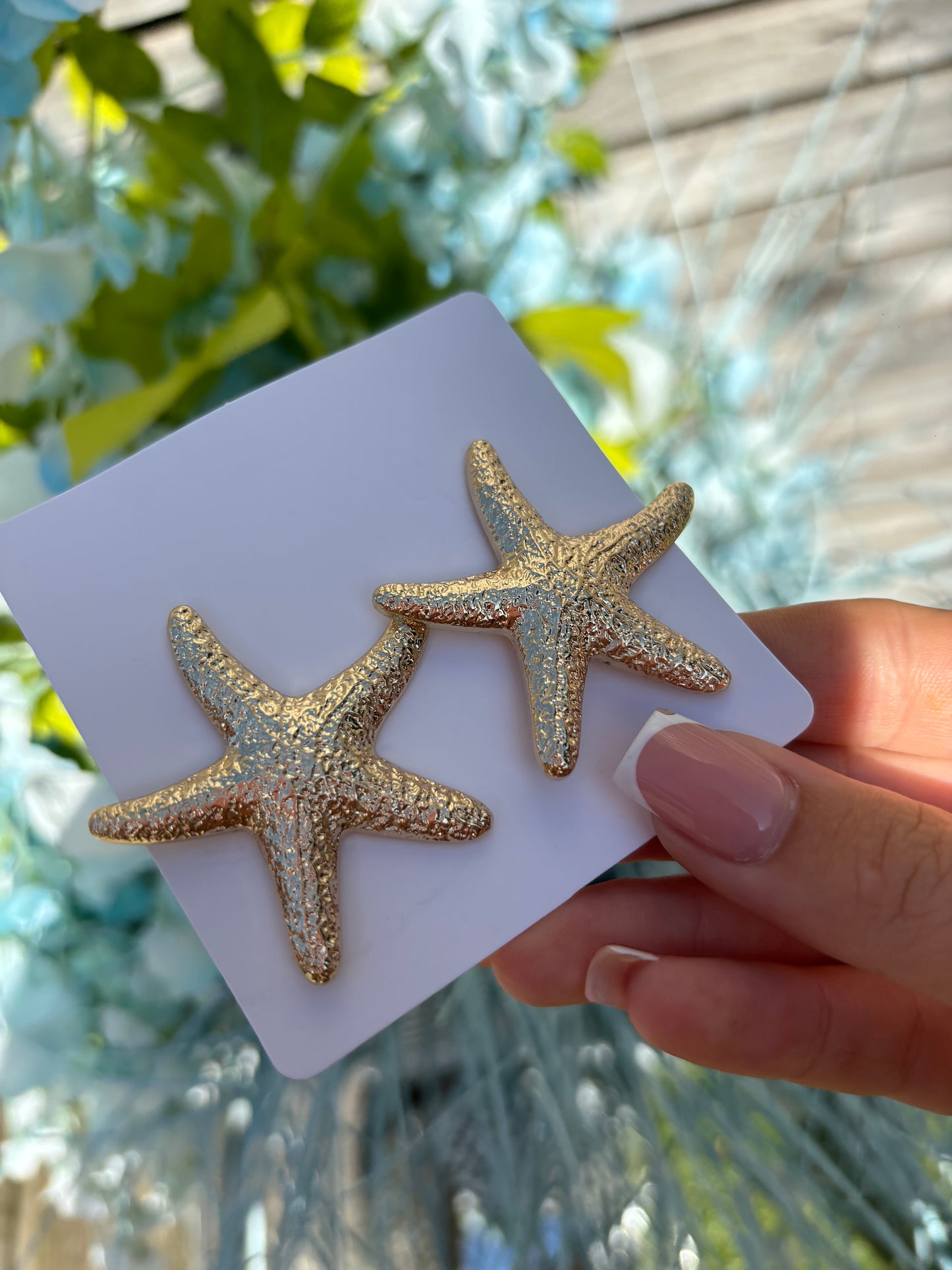 Smaller gold star fish earrings